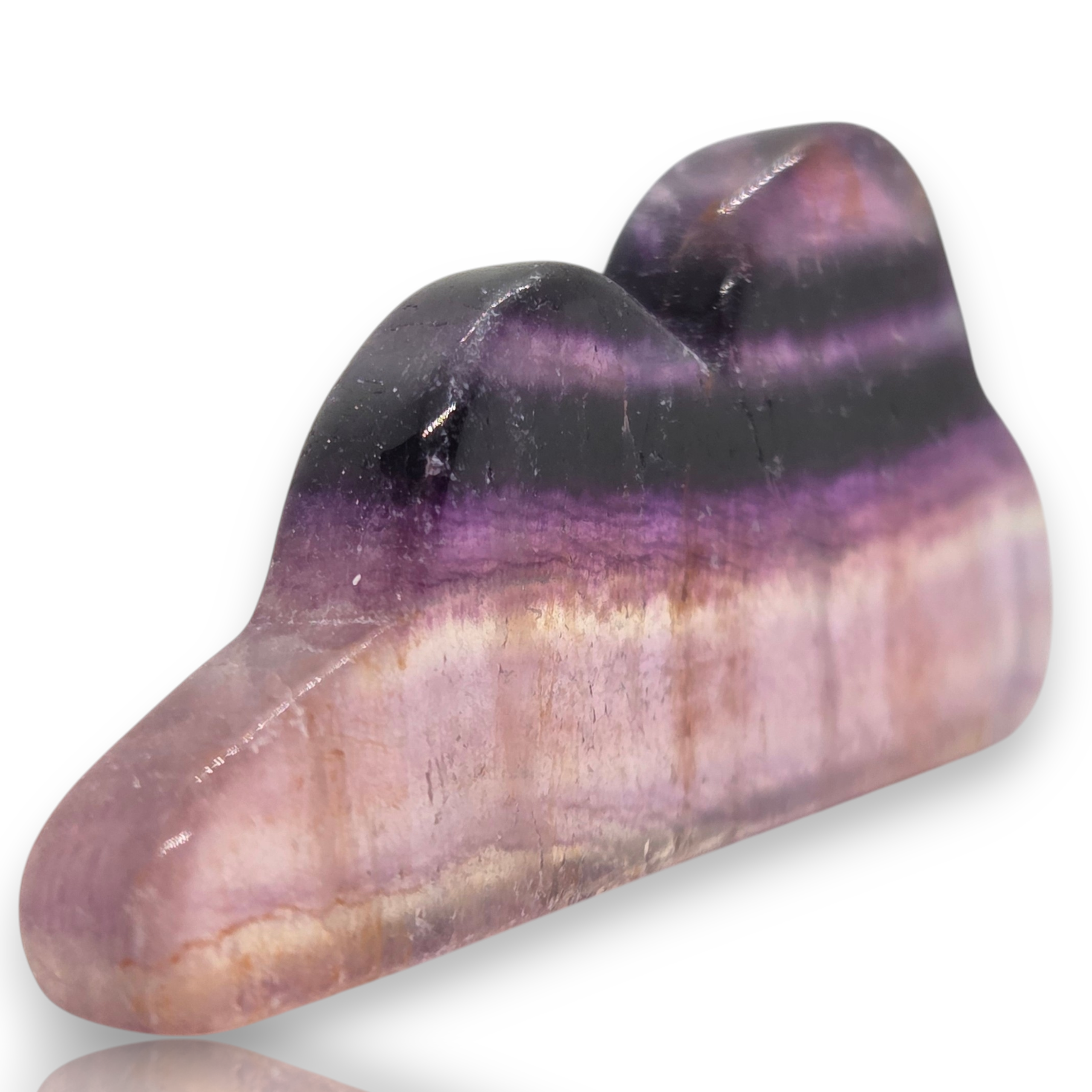 A polished purple and pink striped gemstone cabochon with a glossy finish, displayed on a white background 
