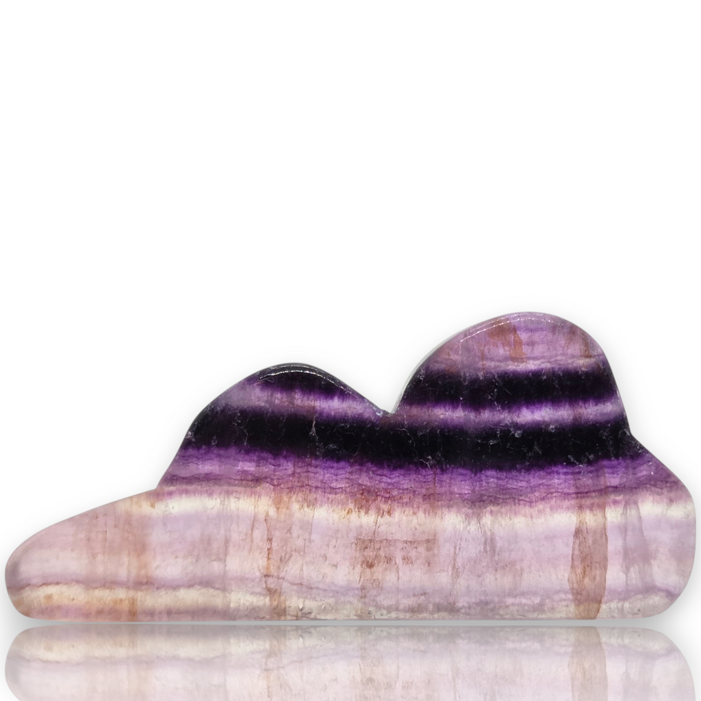 A polished purple and lavender striped stone gua sha massage tool with a cloud-like double-peak shape, displayed on a clean white background 