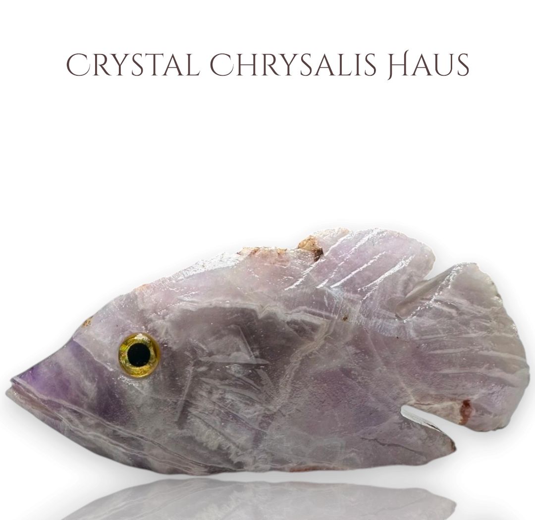 Crystal Chrysalis Haus hand-carved rough amethyst crystal fish figurine with a detailed eye for spiritual decor.