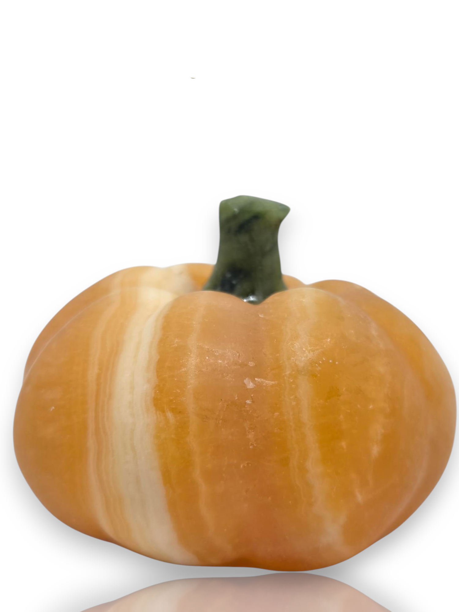 An orange and cream marbled pumpkin-shaped product with a dark green stem, shown on a white background 