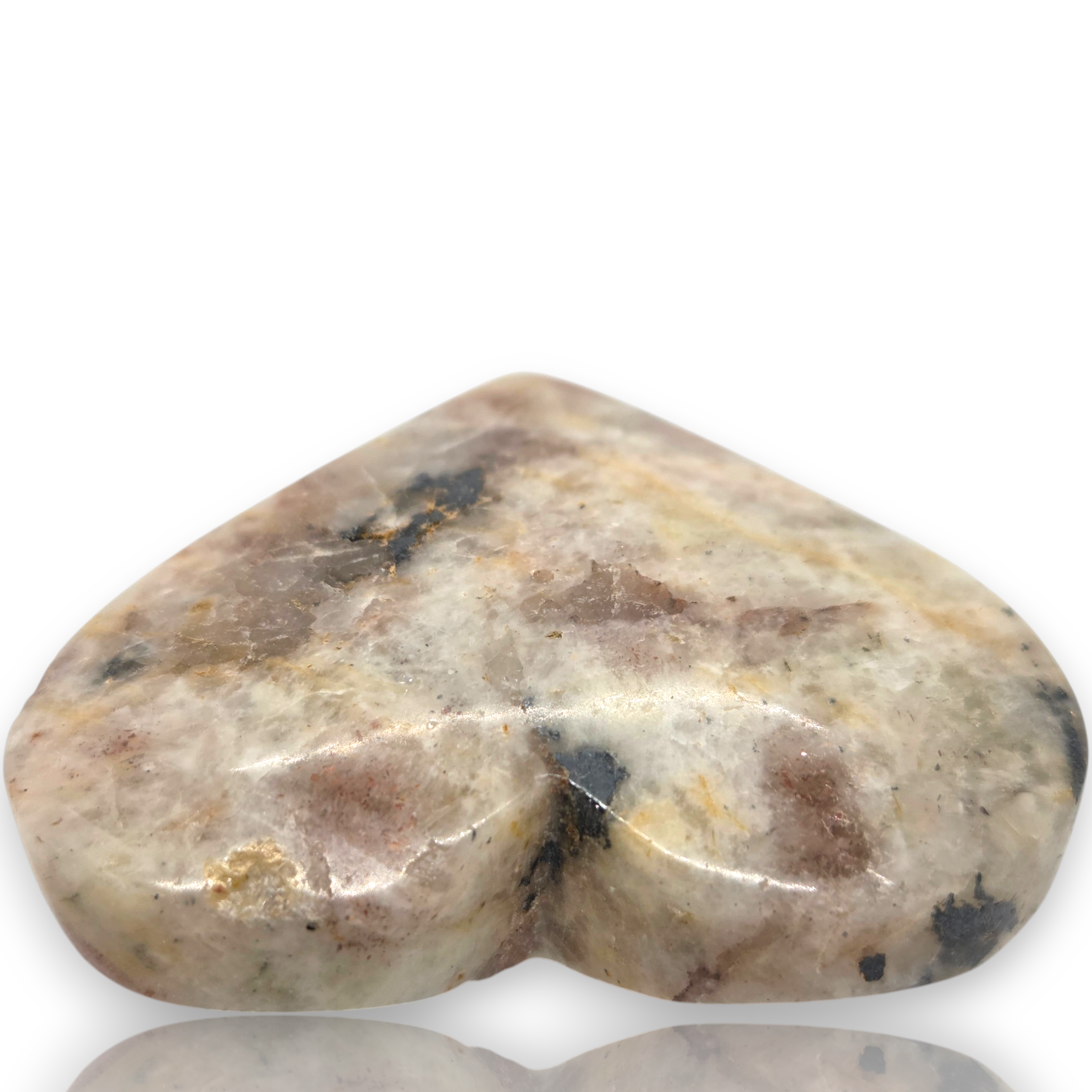 Crystal Chrysalis Haus  A polished heart-shaped stone with a marbled pattern of beige, brown, gray, and black, displayed on a white background with a reflection below 