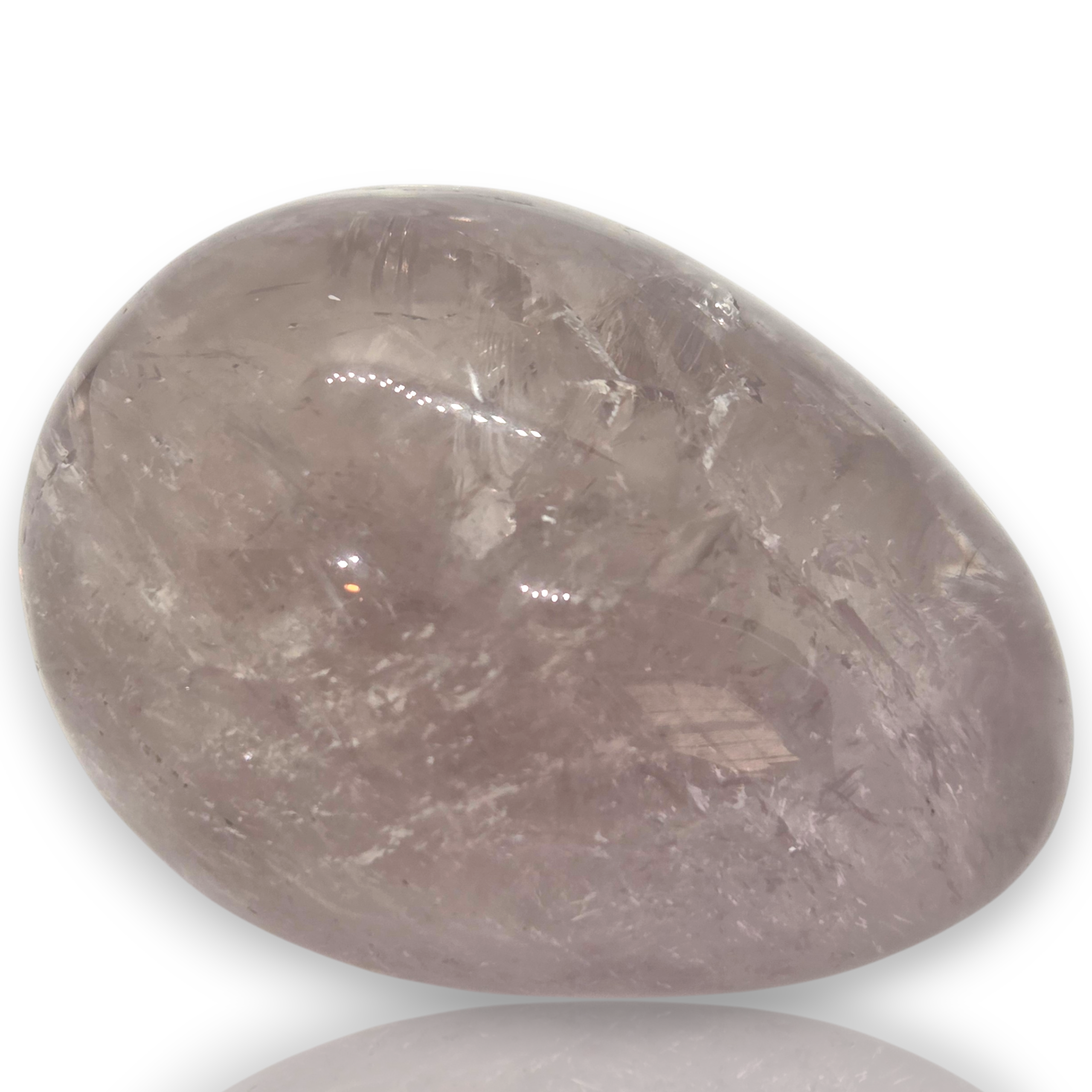 Crystal Chrysalis Haus  A smooth, polished tumbled crystal stone with natural inclusions, shown on a white background 