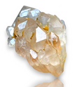 Crystal Chrysalis Haus A raw crystal cluster specimen with translucent pale peach and milky white facets, showing small gold inclusions, photographed on a white background 