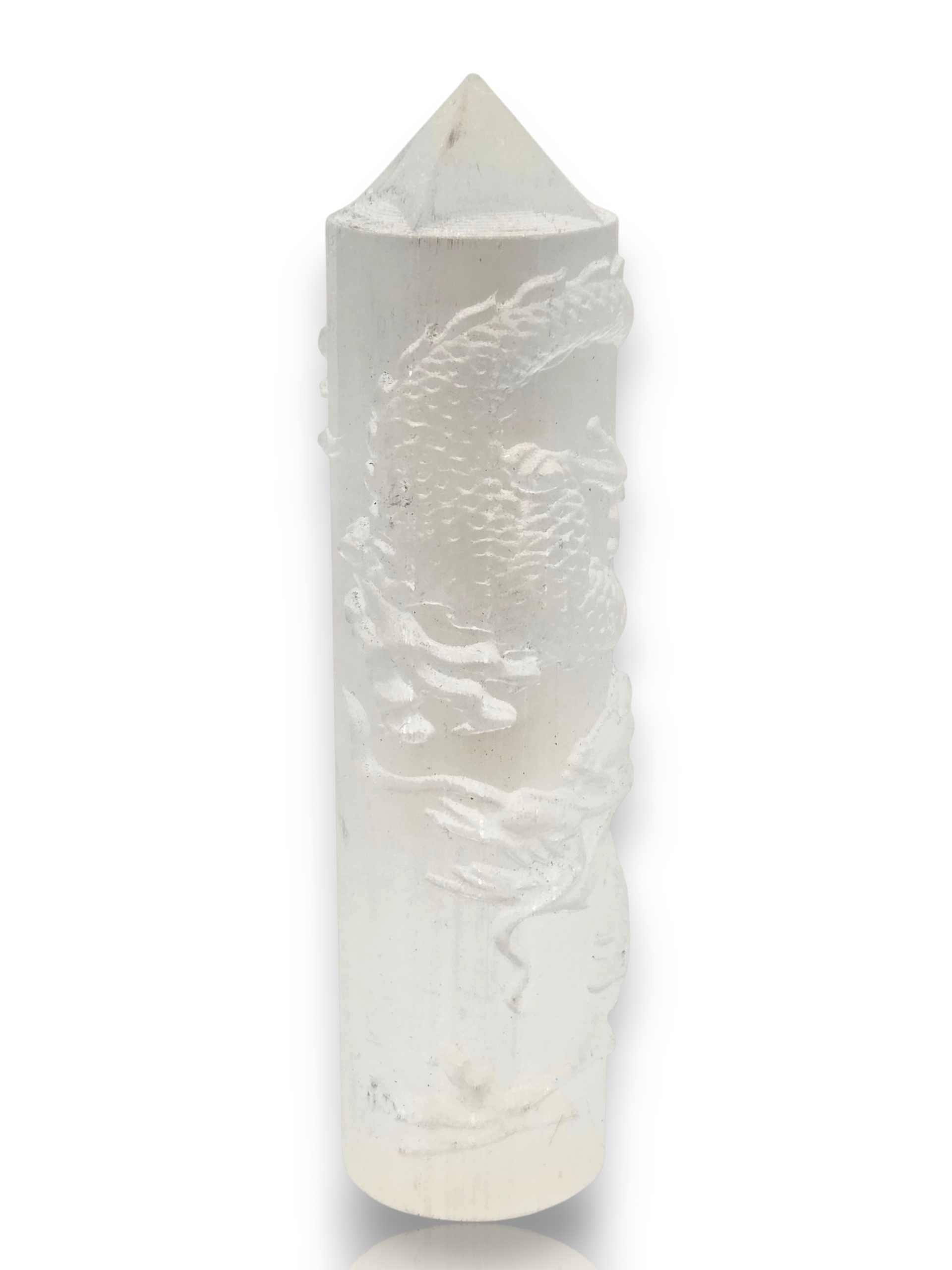 Crystal Chrysalis Haus A white carved crystal tower with a dragon motif, featuring a pointed top, shown on a white background 