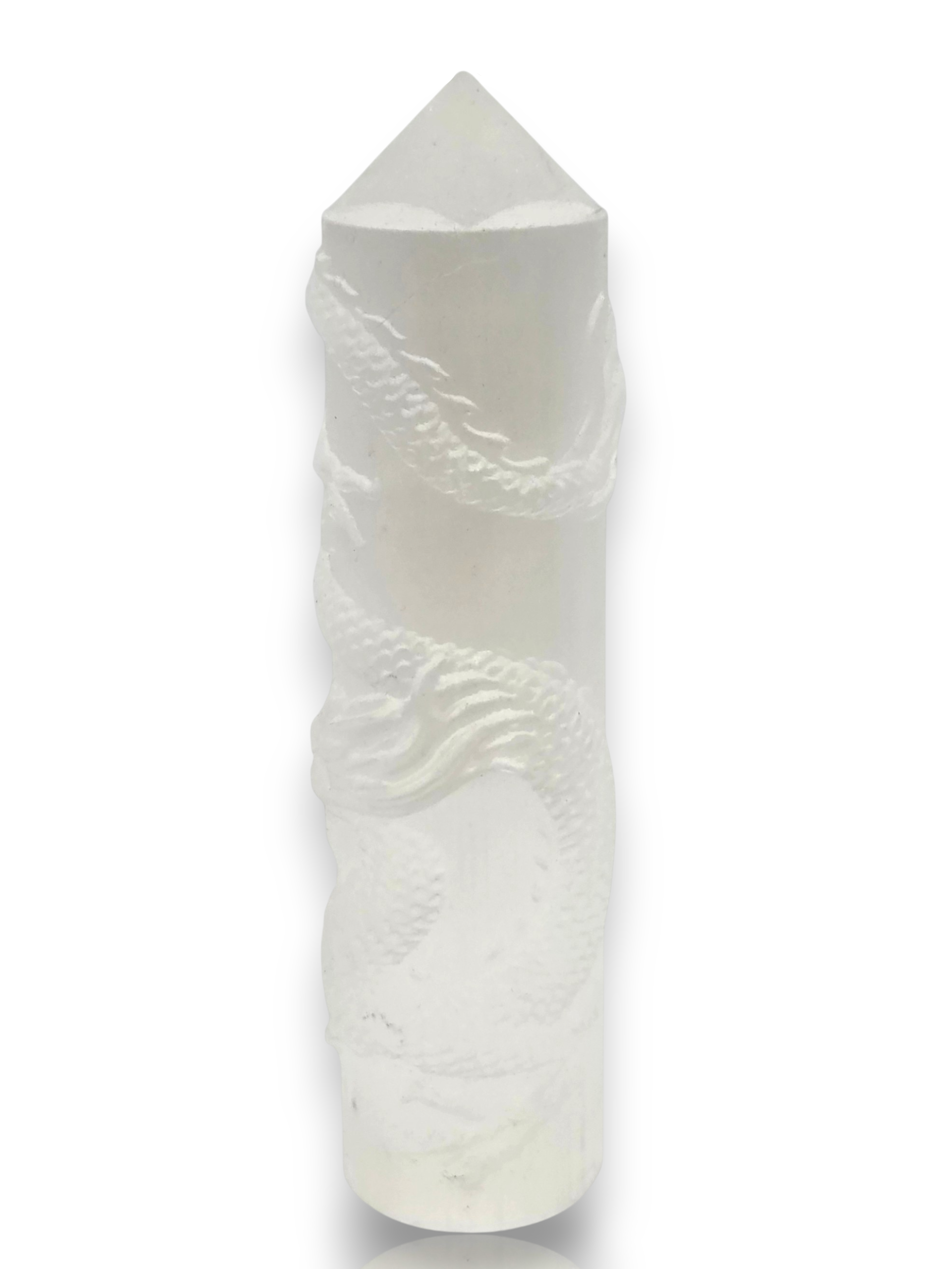 Crystal Chrysalis Haus A white carved crystal pillar with a dragon motif, featuring a pointed conical top, shown on a plain white background 
