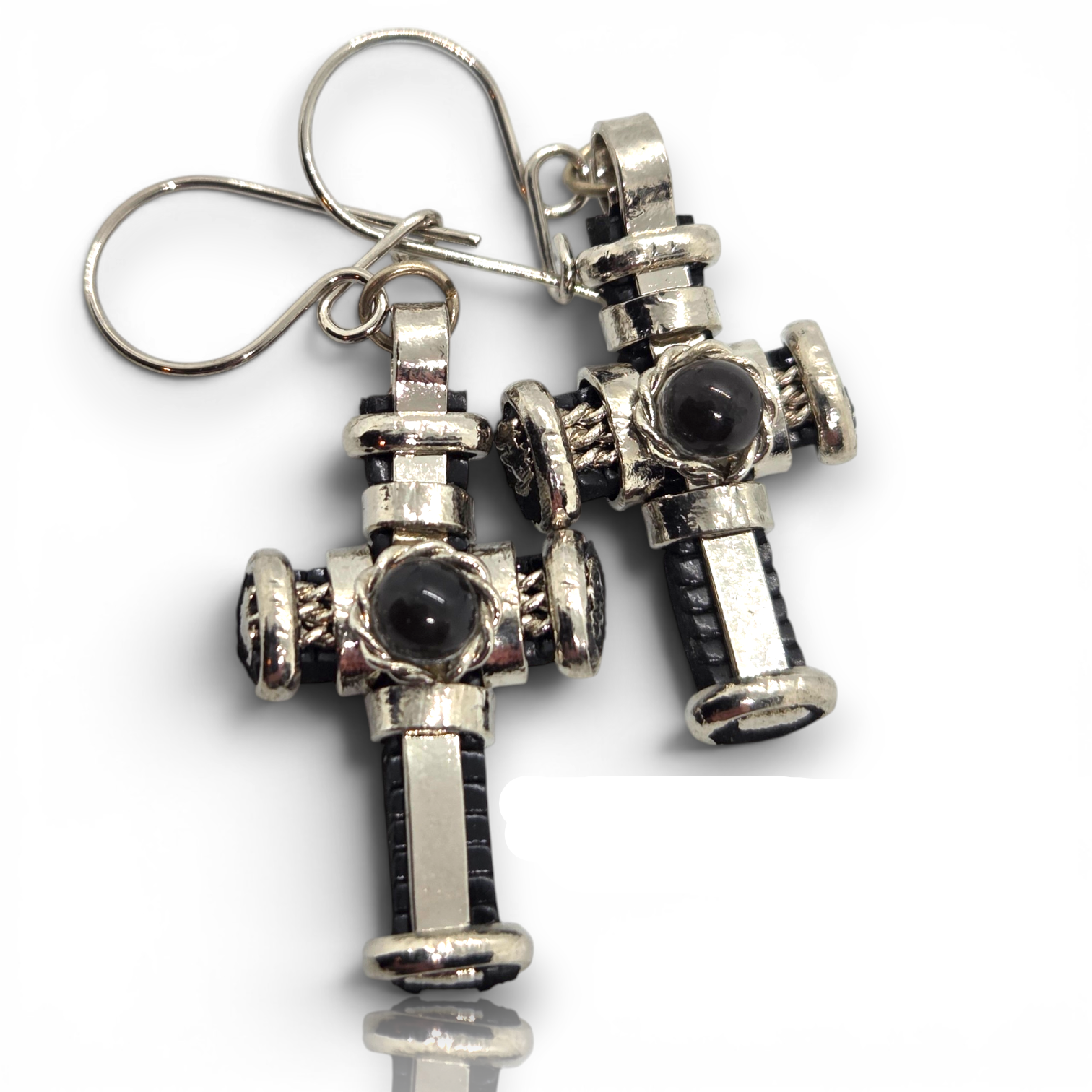 Crystal Chrysalis Haus A pair of silver-toned fire hydrant dangle earrings with black inlay and a central black oval stone, shown on a white background.