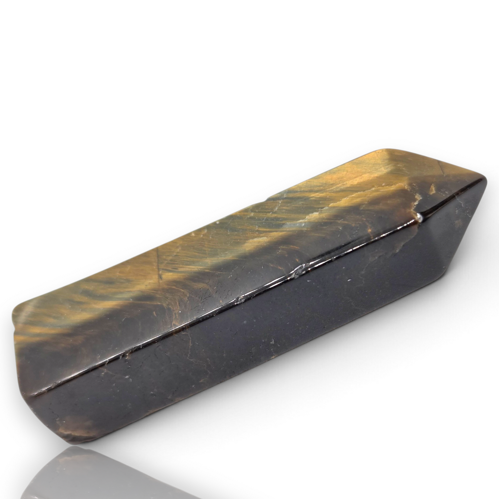 Crystal Chrysalis Haus A polished rectangular crystal point with a dual-tone coloration, featuring a dark brown base and a golden-brown tiger's eye pattern on top, shown on a white background with a soft reflection.