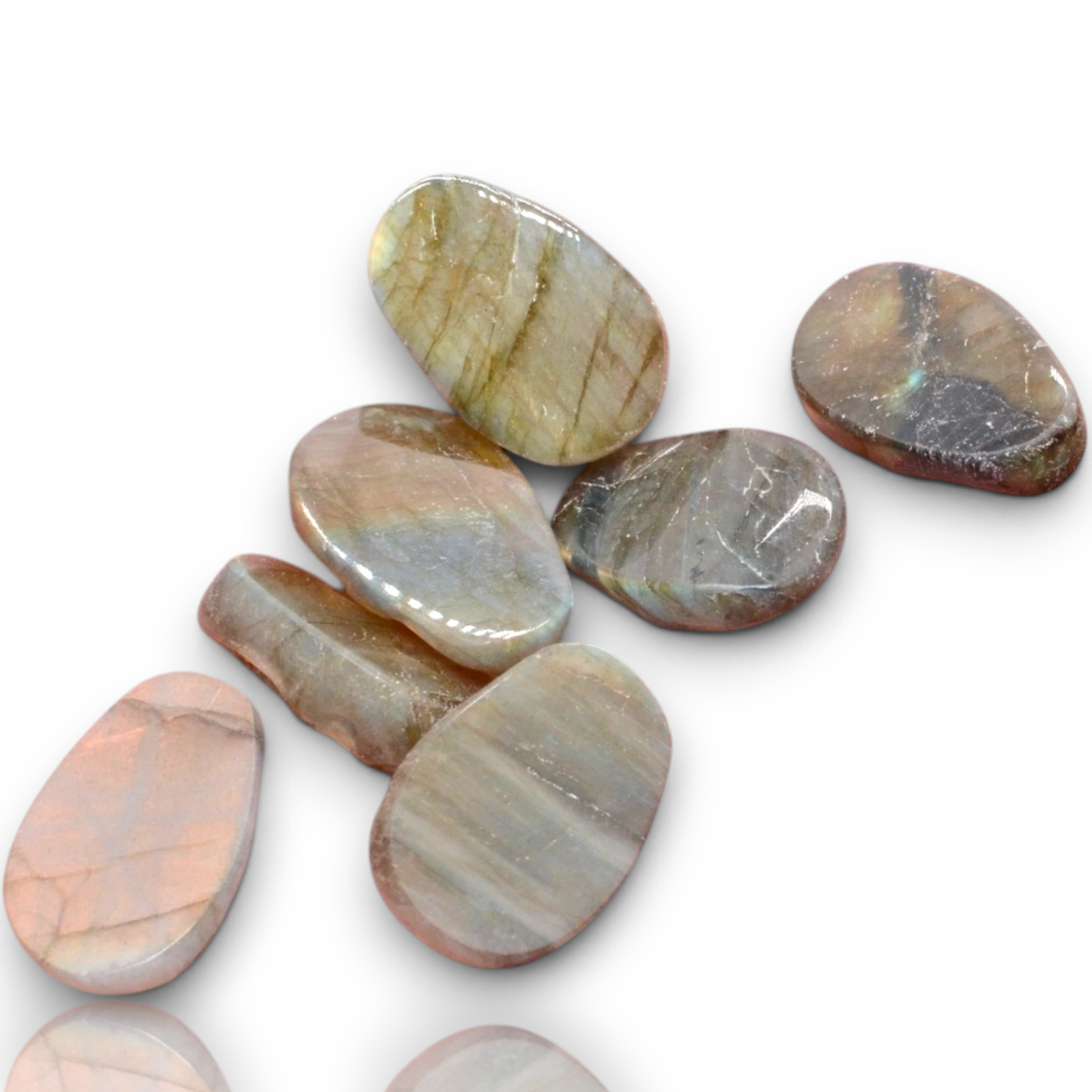 Seven polished oval gemstone cabochons with natural marbled patterns in earthy tones of beige, brown, gray, and soft pink, arranged on a white background 