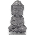 Crystal Chrysalis Haus A small gray stone Buddha statue in a seated meditation pose, centered on a white background with a subtle reflection below.