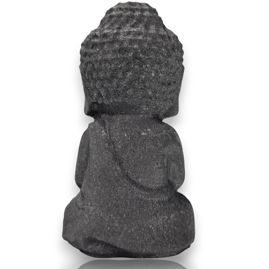 Crystal Chrysalis Haus A dark gray stone Buddha statue shown from the back, featuring a textured, coiled hair style and draped robes, set against a plain white background.